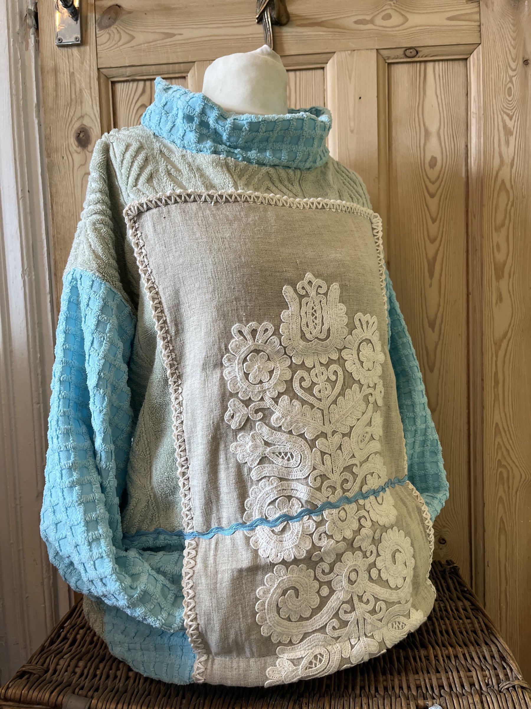 Hand embroidered linen with candlestick,towelling and rickrack trim