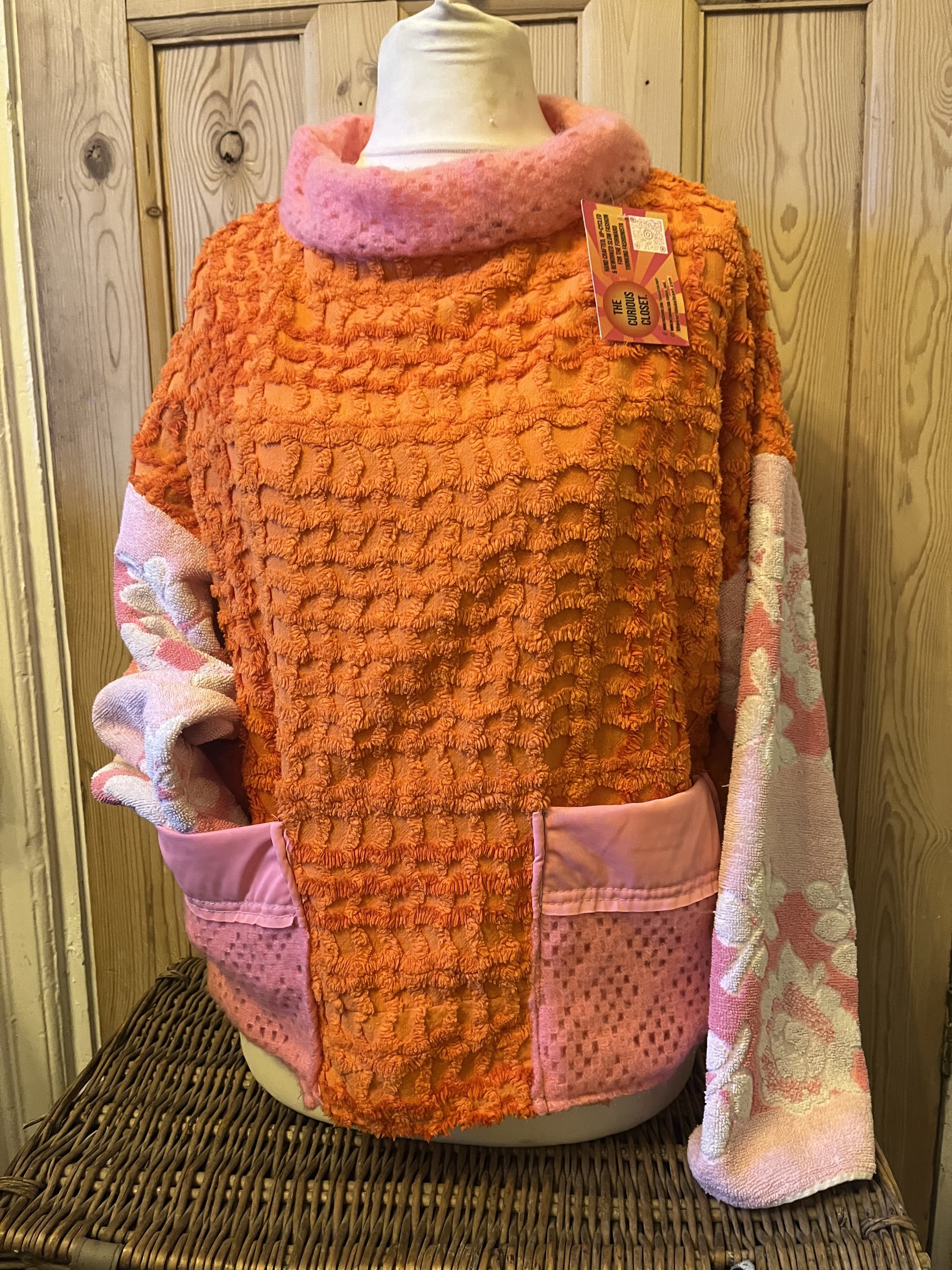 orange candlewick cellular blanket and pastel towels